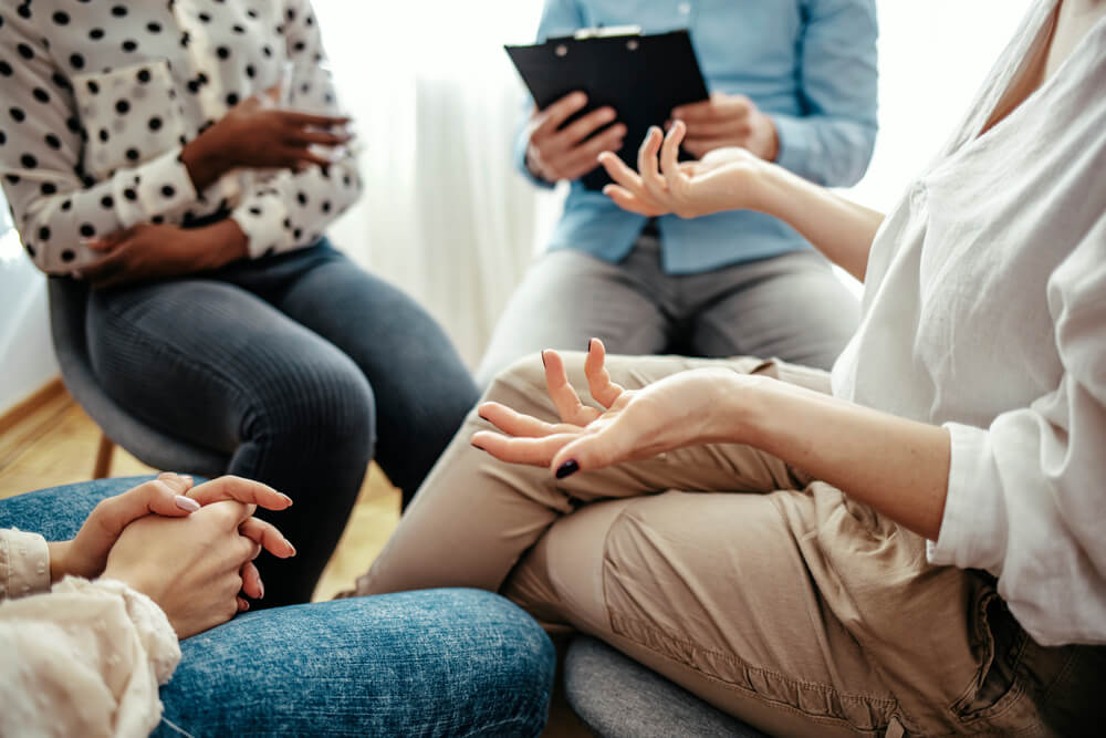 woman participates in group therapy
